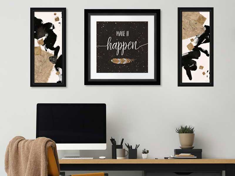 framed black and gold art in an office