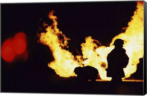 Framed Firefighters In front Of Flames Extinguishing A Fire Print