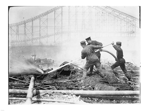 Framed Three firefighters extinguishing a fire Print