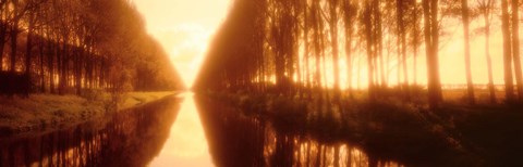 Framed Belgium, tree lined waterway through countryside, sepia tone Print