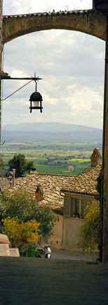 Framed Umbrian countryside viewed through an alleyway, Assisi, Perugia Province, Umbria, Italy Print