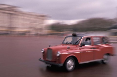 Framed Cab racing past Buckingham Palace, London, England Print