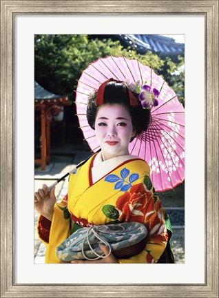 Framed Geisha holding a parasol, Kyoto, Japan Print