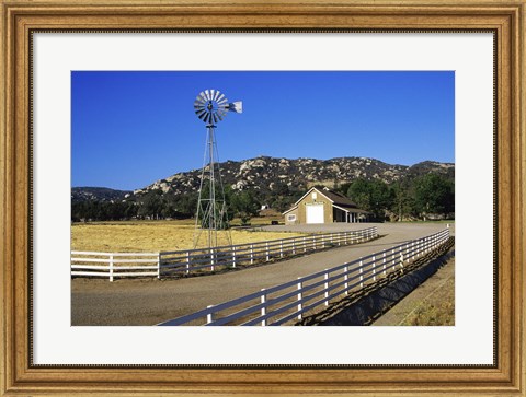 Framed Industrial windmill on a farm, California, USA Print