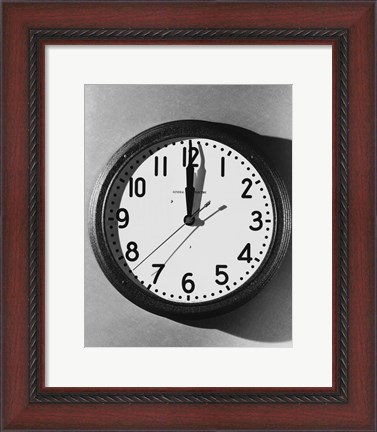 Framed Close-up of a wall clock hanging on a wall Print