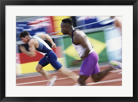 Framed Side profile of two young men running on a running track Print