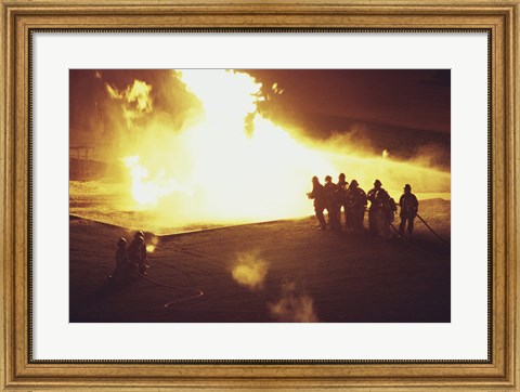 Framed High angle view of firefighters extinguishing a fire Print