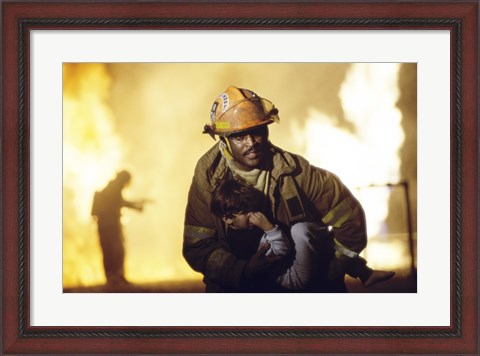 Framed Firefighter carrying a boy Print