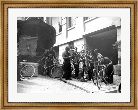 Framed Taking care of  maintenance of the racing bicycles during a rest day in Belfort Print