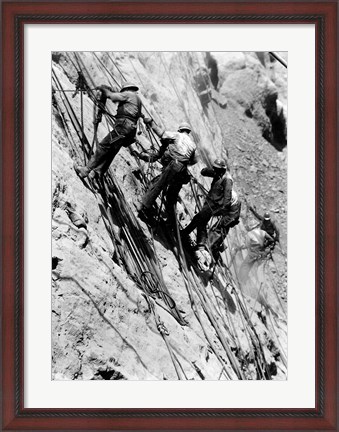 Framed Drillers at work on canyon wall above power plant location Print