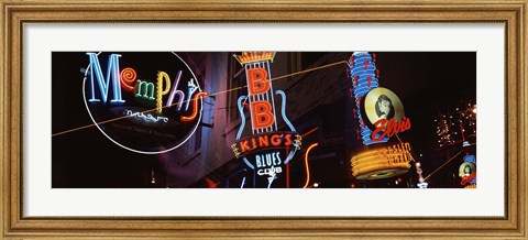 Framed Low angle view of neon signs lit up at night, Beale Street, Memphis, Tennessee, USA Print