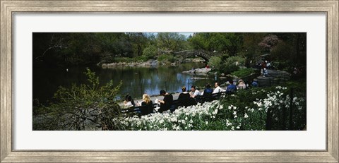 Framed Group of people sitting on benches near a pond, Central Park, Manhattan, New York City, New York State, USA Print