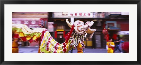 Framed Group of people performing dragon dancing on a road, Chinatown, San Francisco, California, USA Print