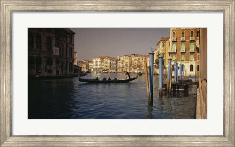 Framed Tourists sitting in a gondola, Grand Canal, Venice, Italy Print