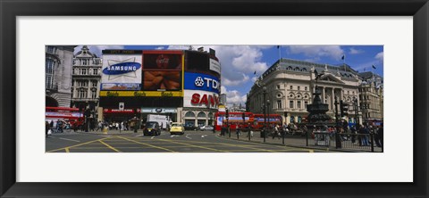 Framed Commercial signs on buildings, Piccadilly Circus, London, England Print