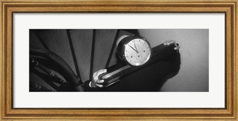 Framed Man Carrying Clock Up Stairs On Shoulders Print