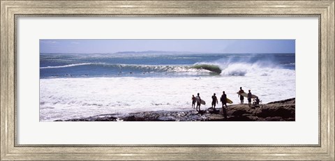 Framed Silhouette of surfers standing on the beach, Australia Print