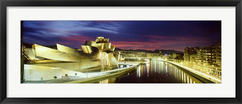 Framed Buildings lit up at dusk, Guggenheim Museum Bilbao, Bilbao, Vizcaya, Spain Print