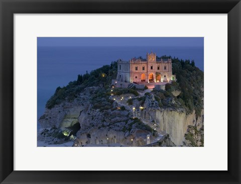 Framed High angle view of a church lit up at dusk on a cliff, Santa Maria dell Isola, Tropea, Calabria, Italy Print