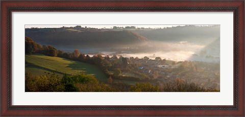 Framed Misty morning valley with village, Uley, Gloucestershire, England Print