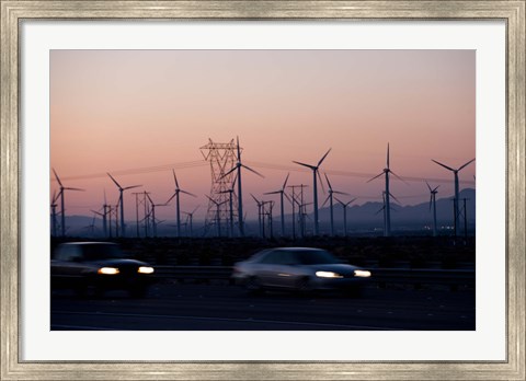 Framed Cars moving on road with wind turbines in background at dusk, Palm Springs, Riverside County, California, USA Print