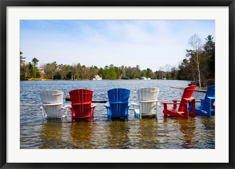 Framed Adirondack chairs partially submerged in the Lake Muskoka, Ontario, Canada Print