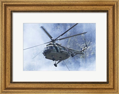 Framed Bulgarian Air Force Mi-17 helicopter over a forest fire in Bulgaria Print