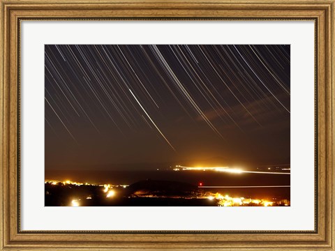 Framed Star trails above a village in the central desert of Iran Print