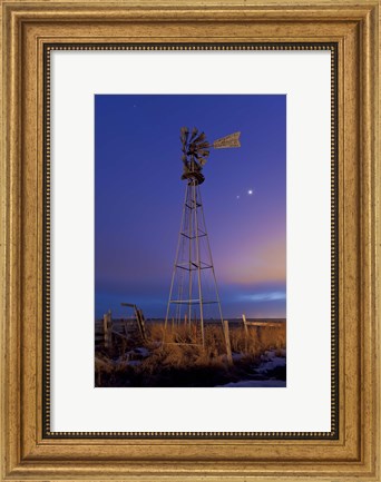 Framed Venus and Jupiter are visible behind an old farm water pump windmill, Alberta, Canada Print