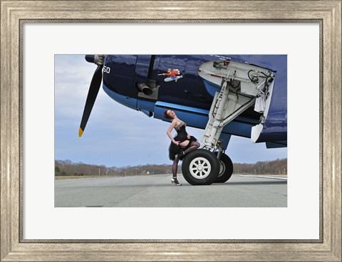 Framed 1940&#39;s style pin-up girl resting on the wheel of a TBM Avenger Print