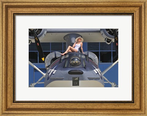 Framed Retro pin-up girl posing with a World War II era PBY Catalina seaplane Print