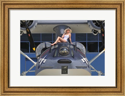 Framed Retro pin-up girl posing with a World War II era PBY Catalina seaplane Print