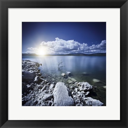 Framed Tranquil lake and rocky shore with sun over horizon, Sardinia, Italy Print