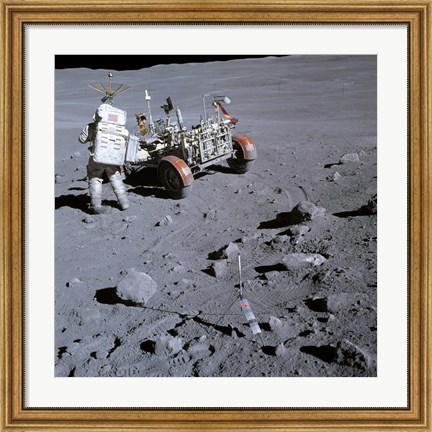 Framed Astronaut walking near the lunar rover on the moon, Apollo 16 Print