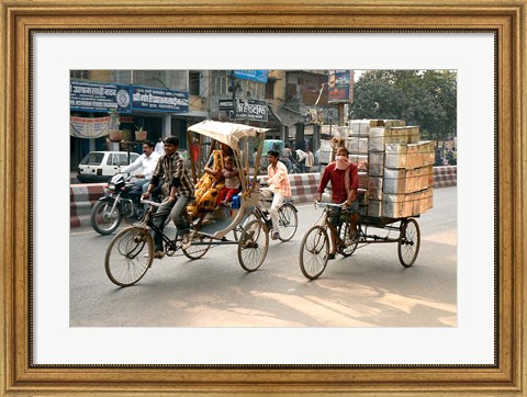 Framed People and cargo move through streets via rickshaw, Varanasi, India Print