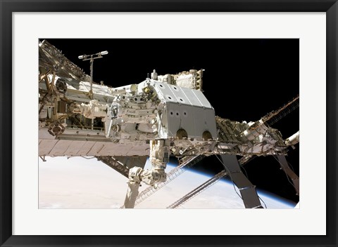 Framed Canadian-Built Dextre Robotic System in the Grasp of the Robotic Canadarm2 Print