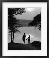 Framed Man And Woman In Bathing Suits Holding Hands Watching Sunset Lakeside