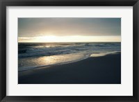 Framed Waves breaking on the beach at sunrise