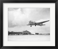 Framed Low angle view of a military airplane landing, Douglas DC-3