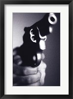 Framed Close-up of a person holding a handgun