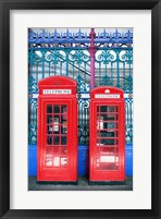 Framed Two telephone booths near a grille, London, England