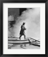 Framed Firefighter walking in front of smoke