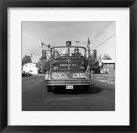 Fire engine on road Framed Print