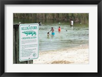 Framed Alligators warning sign at the lakeside, Florida, USA