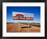 Framed Distance sign on the road side, Ayers Rock, Uluru-Kata Tjuta National Park, Australia