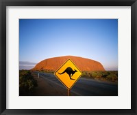 Framed Kangaroo sign on a road with a rock formation in the background, Ayers Rock