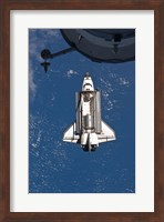 Framed STS-135 Atlantis approaches the ISS