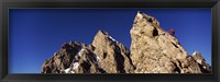 Framed Low angle view of a man climbing up a mountain, Rockchuck Peak, Grand Teton National Park, Wyoming, USA