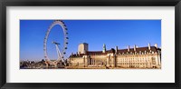 Framed Ferris wheel with buildings at the waterfront, River Thames, Millennium Wheel, London County Hall, London, England