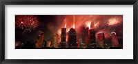 Framed Fireworks over buildings in a city, Houston, Texas